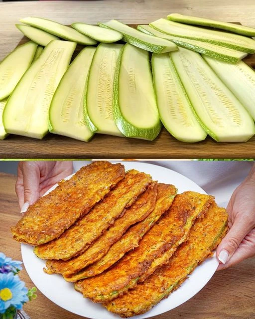 Panierte Zucchini-Scheiben mit Parmesan auf einem Teller