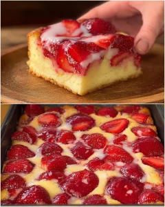 Delizioser Erdbeer-Biskuitkuchen vom Blech mit frischen Erdbeeren garniert.